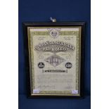 A framed Compania Mexicana De Petroleo SA shares certificate.