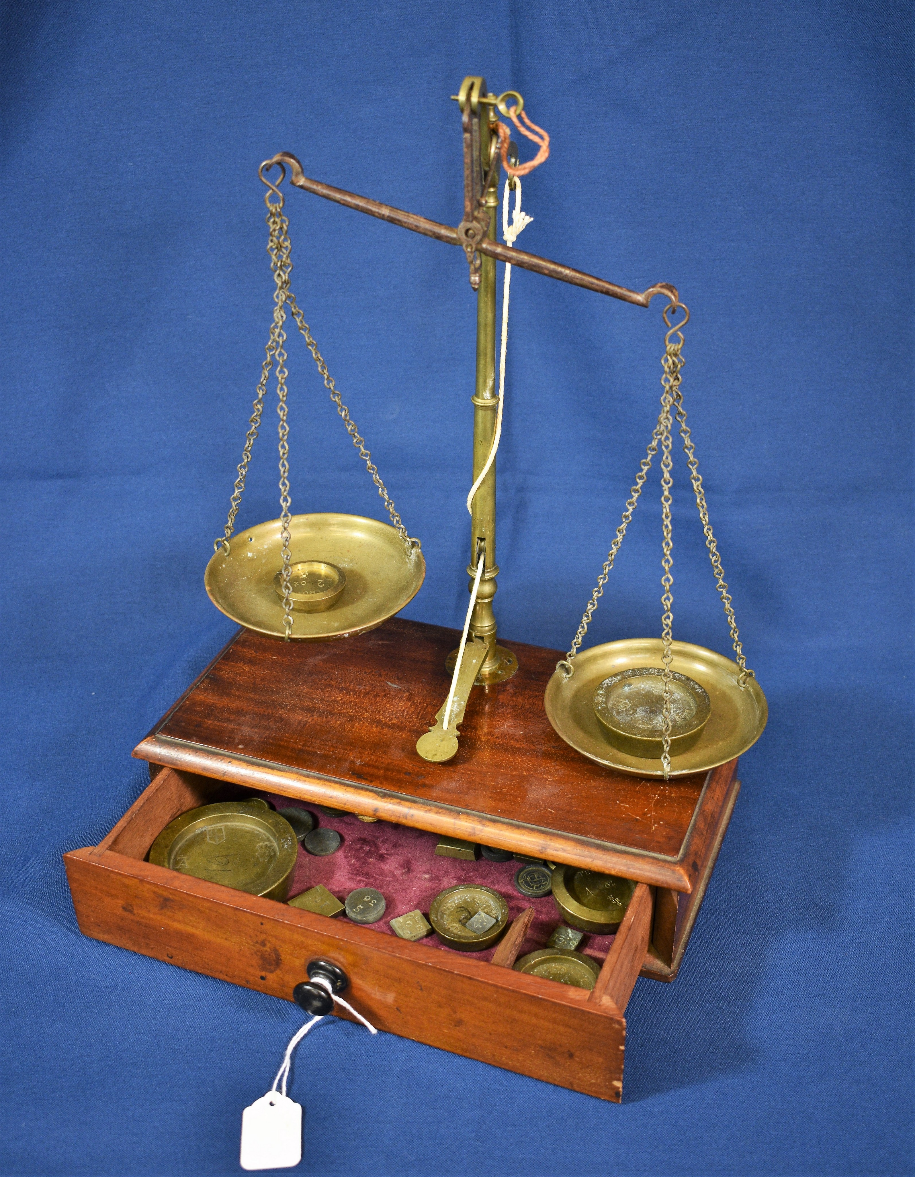 A pair of Victorian brass W & T Avery percussion beam scales screwing in and standing on mahogany