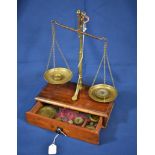 A pair of Victorian brass W & T Avery percussion beam scales screwing in and standing on mahogany