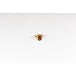 A 9ct gold and carnelian signet ring, size K.