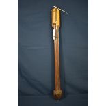 A mid-19th century rosewood stick barometer the arched top with ivorine scale signed 'J. H. Steward,