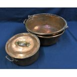 Two antique copper & brass cooking pots one with metal swing handle, the other with twin brass
