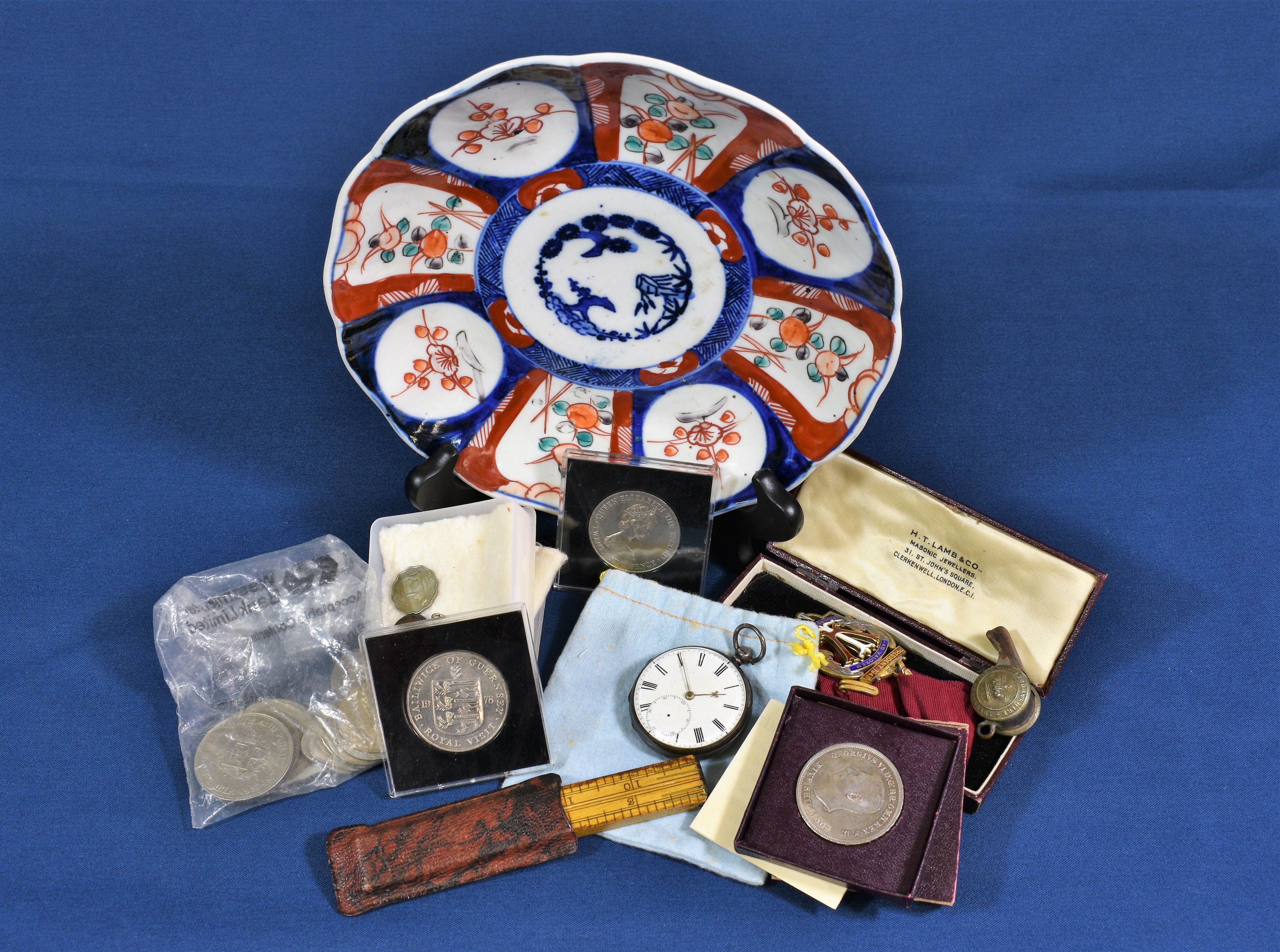 A silver cased open face pocket watch (movement damaged) together with a gilt and enamel medal; a