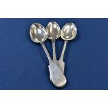Three Channel Islands silver fiddle pattern table spoons each overstruck with Jersey makers, the