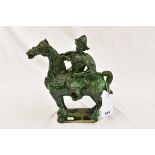 A Chinese green glazed terracotta warrior on a horse (head repaired).