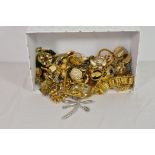 A quantity of various costume jewellery including oversized clip on earrings, brooches, necklaces