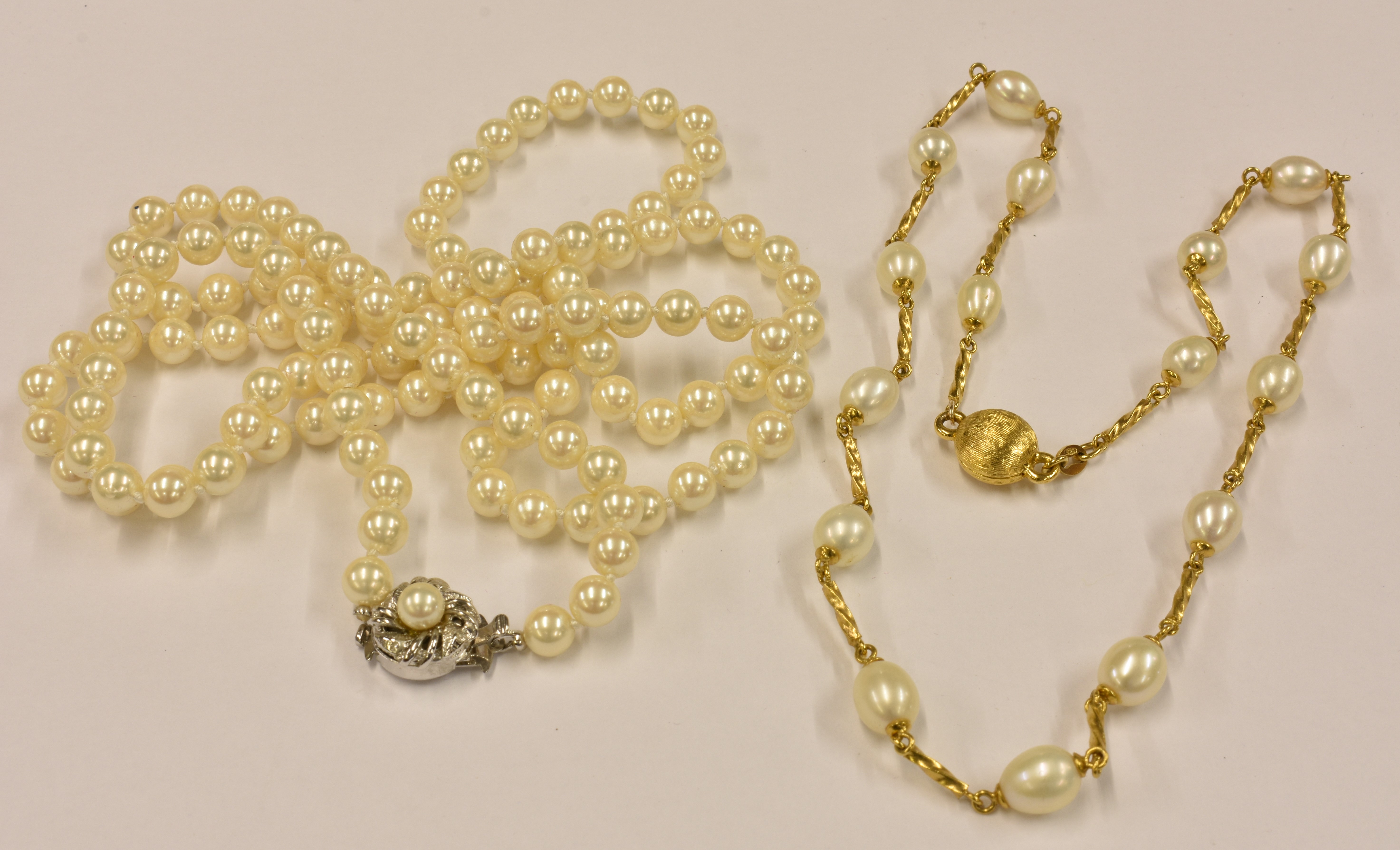 A freshwater pearl and silver gilt short necklace; together with a faux-pearl necklace. (2)