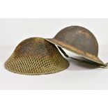 Two British army helmets
