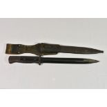 A WW2 German K98 bayonet. Blade stamped 3914 over Tr, scabbard marked 9958 over g and CLEMENu.