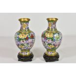 A pair of Chinese Cloisonne vases, 20th century, of baluster form, decorated with a floral design on
