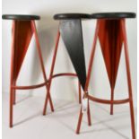 A set of three Art Deco / Modernist French painted steel tall stools with later ebonised circular