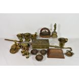 A collection of antique brassware etc comprising of a Georgian brass chamberstick; The Seamless