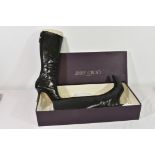A boxed pair of Jimmy Choo black kid boots, European size 38 / UK 5.
