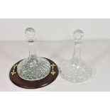 Two fine lead crystal ships decanters with star cut bases, one having original sticker and wooden