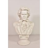 A modern plaster bust of Beethoven made by Condor Holland (sticker to base), 17 3/4in. (45cm.) high.