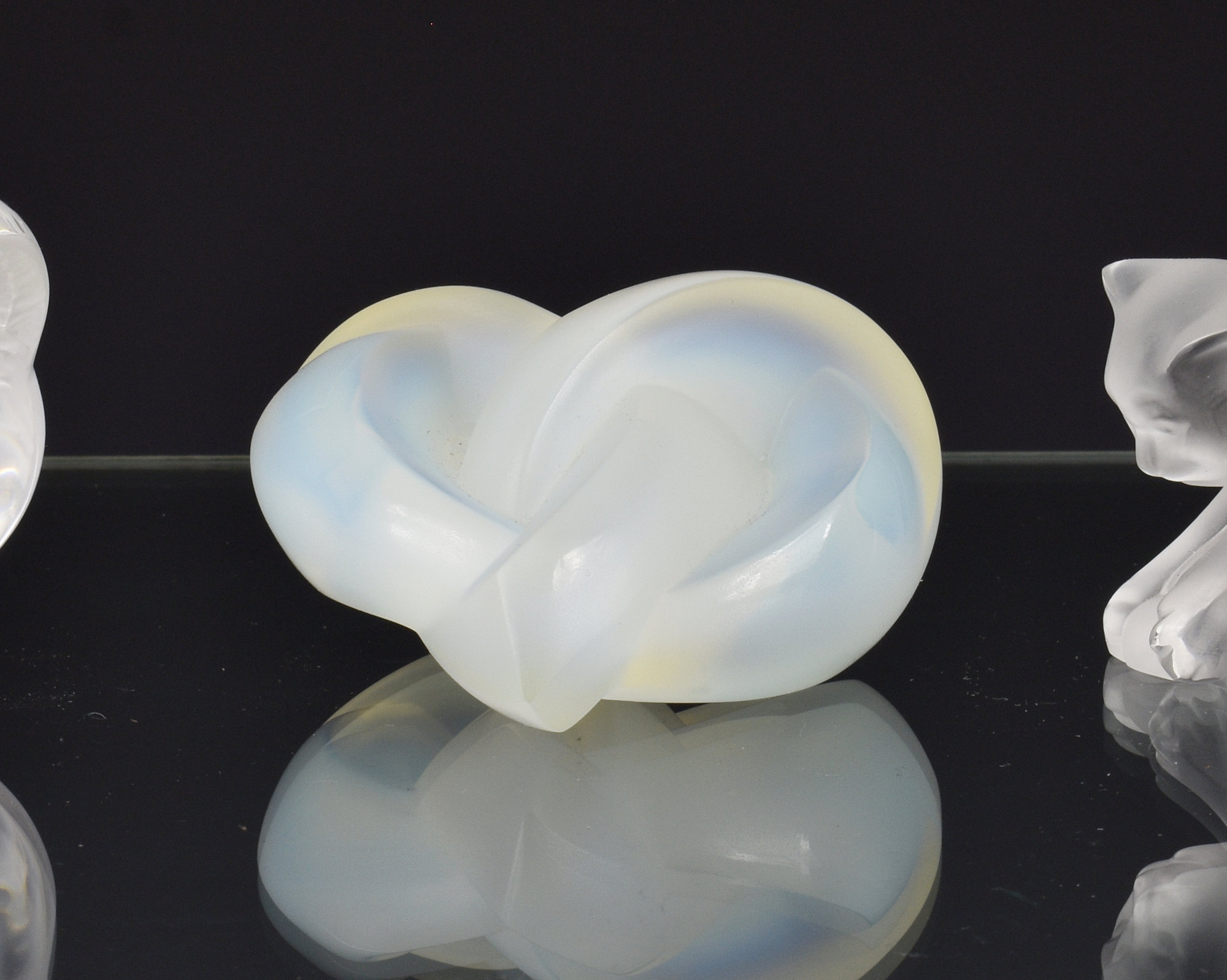A Lalique opalescent glass 'love heart' paperweight, fourth quarter 20th century, etched mark to