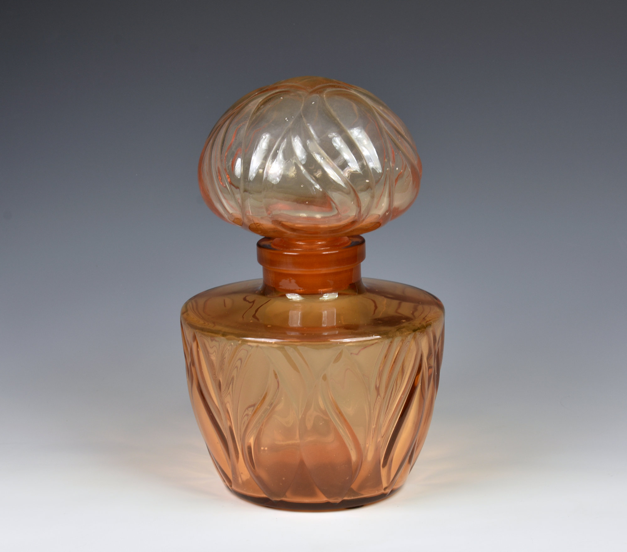 A large Faberge amber glass 'FLEURS DU MONDE' factice or perfume display bottle, 1940s, having a