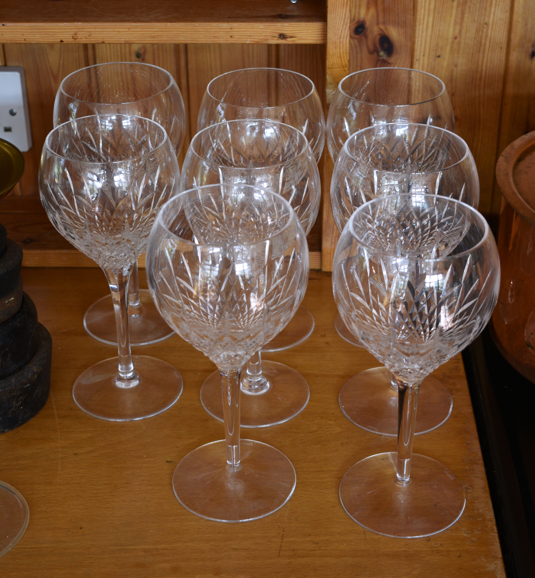 A set of eight Stuart Crystal large cut glass wine glasses.,