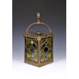 A 19th century brass and leaded stained glass hall lantern of rectangular form with pierced Gothic