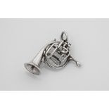 A vintage silver French horn pendant 3cm. long.