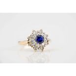 A 9ct gold, faux sapphire and CZ cluster ring size O.
