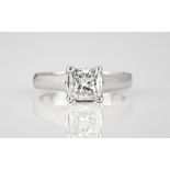 A platinum and diamond single stone ring the 1.65ct princess cut diamond in an open four claw