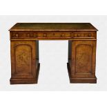 A Victorian burr walnut double pedestal desk the thumb moulded top with inset gilt tooled green