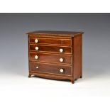 An apprentice piece mahogany and boxwood four drawer chest 19th century, the four drawers with