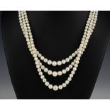 A triple strand cultured pearl necklace mid-century, the pearls graduated from 3mm. to 7.5mm.,