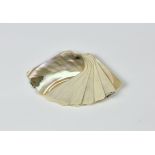 A Victorian mother of pearl aide memoire the rounded rectangular sleeves having white metal ornate
