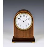 An Edwardian mahogany cased mantel clock with French movement with outside platform escapement,