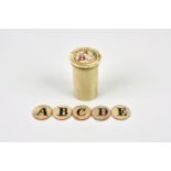 An unusual 19th century cylindrical bone box with double sided alphabet discs the turned screw off