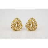 A pair of 18ct yellow gold and diamond knot earrings each set with thirty six brilliant cut