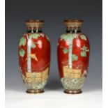 A pair of Japanese red ground cloisonné vases Meiji period (1868-1912), unmarked, of slender ovoid