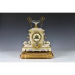 A 19th century French alabaster cased mantel clock surmounted by a squat lidless urn with gilt metal