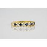 An 18ct yellow gold, sapphire and diamond half eternity ring with alternate round cut sapphires