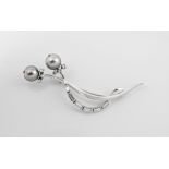 An 18ct white gold, grey South Sea pearl and diamond brooch with two 10.5mm. South Sea pearls, six