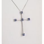 A large 18ct white gold, sapphire and diamond cross pendant the arms set with brilliant cut