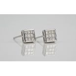 A pair of 18ct white gold and diamond square stud earrings each pavé set with nine princess cut