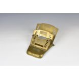 An Art Deco period brass folding letter stand with stamp compartment having three pierced fold