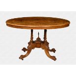 A Victorian burr walnut and marquetry tilt-top centre table the oval quarter veneered top with
