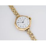 A 9ct gold cased Louisfrey quartz watch the mid-century octagonal case with later dial, movement and