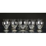 A set of five 19th century glass rummers the ogee bowls on a plain tapered stem with collar and