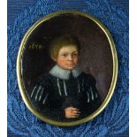 An early 17th century portrait miniature of a boy oil on copper, oval, the boy in a black doublet,