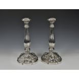 A pair of Austro-Hungarian silver candlesticks 19th century, with fluted baluster columns and shaped