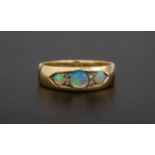 A Victorian 18ct gold, water opal and diamond ring set with three graduated round cabochon opals