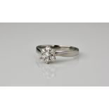 A palladium and diamond cluster ring with a floral cluster of seven brilliant cut diamonds, size N.