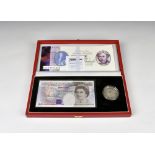 A cased Royal Mint Millennium Twenty Pound banknote and Silver Crown set banknote serial number
