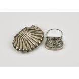 A Continental silver scallop shell purse indistinct marks, the purse opening to reveal red silk