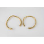 A pair of antique Indian 22ct gold snake bangles 19th / early 20th century, the two open bangles